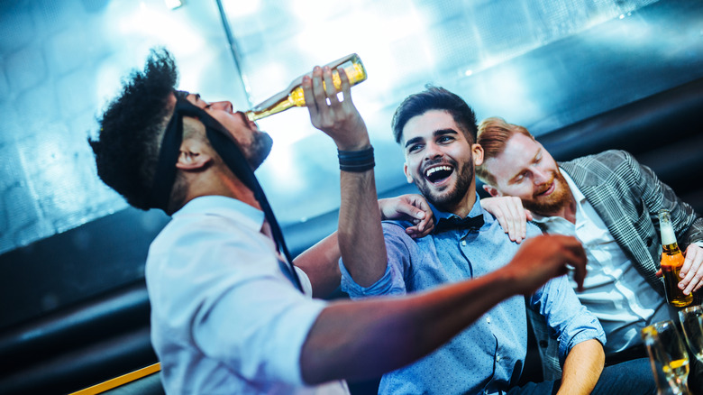 Three guys drinking and partying