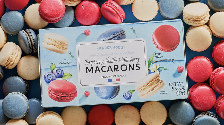 Box of Trader Joe's Raspberry, Vanilla & Blueberry Macarons surrounded by red, blue, and white macarons