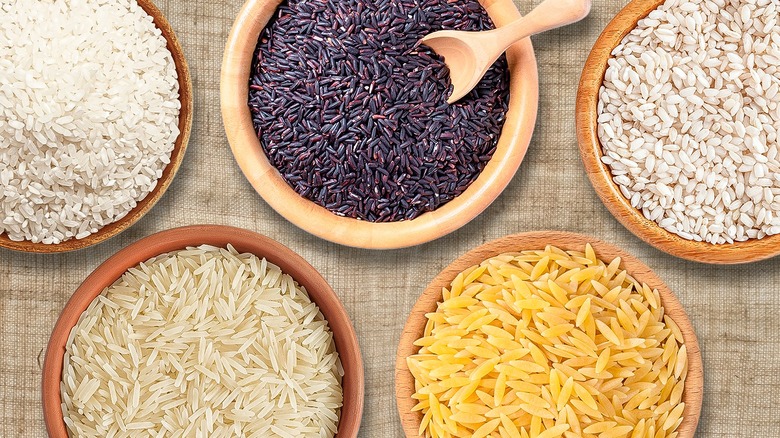 different types of rice in five separate bowls