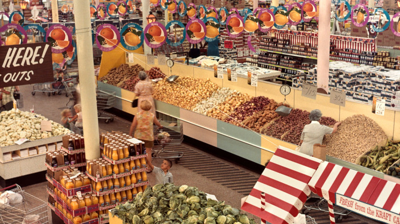 High-angle view of people shopping in a grocery store in the 1960s