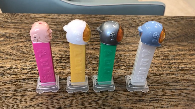 Astronaut A PEZ dispensers in a variety of colors