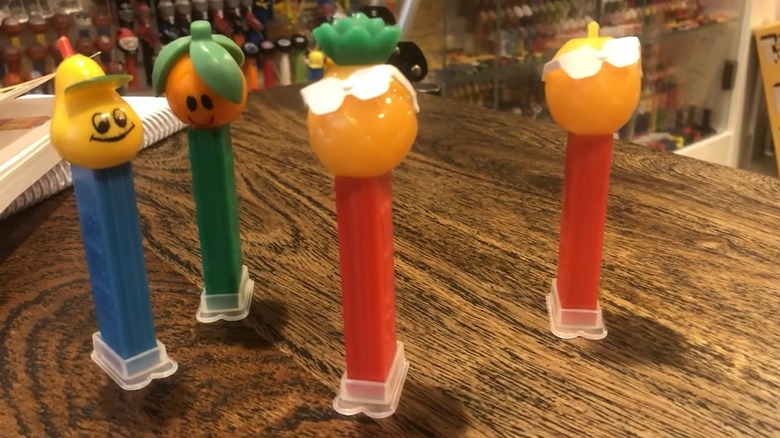 A collection of Crazy Fruit PEZ dispensers, with the pineapple standing out in the center