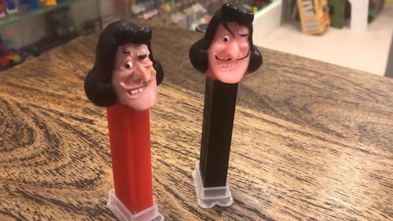 Two soft head Captain Hook PEZ dispensers, one with a red stem and one with a black stem