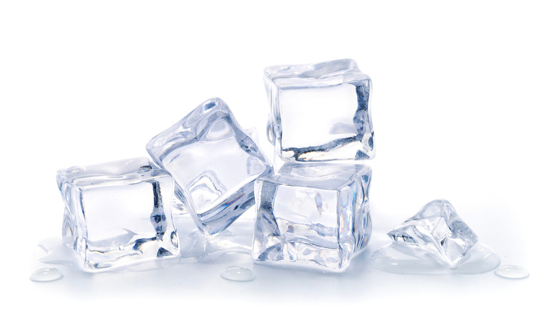 Stack of ice cubes on a white background