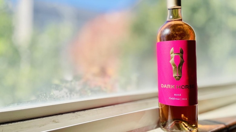 Bottle of Dark Horse California Rosé sitting on ledge