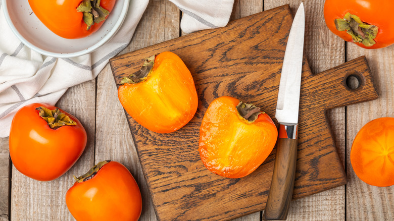 Persimmon on cutting board