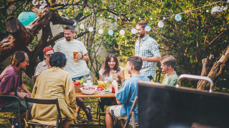 a group of people having a barbecue hang