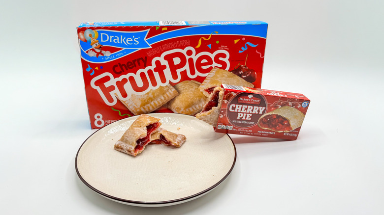 Drake's cherry pie with Aldi cherry pie on white background