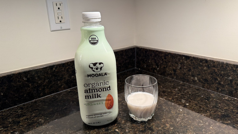 Mooala organic almond milk on countertop