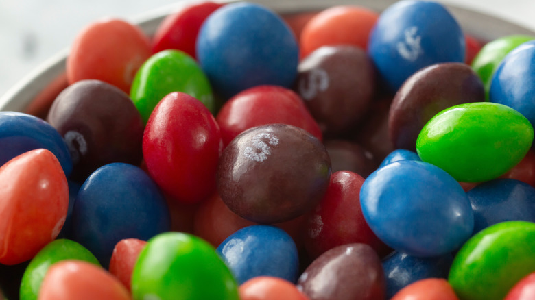 Close up on Skittles in a bowl