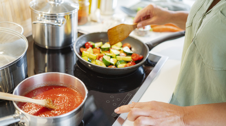 Person cooking on an electric stove