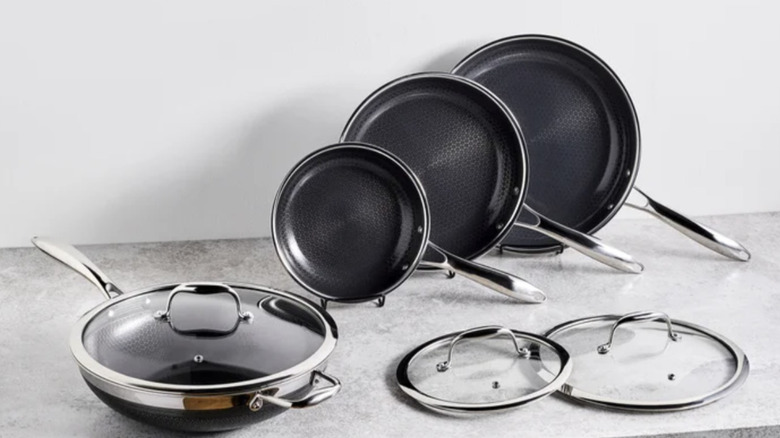 pieces of HexClad cookware on a gray countertop