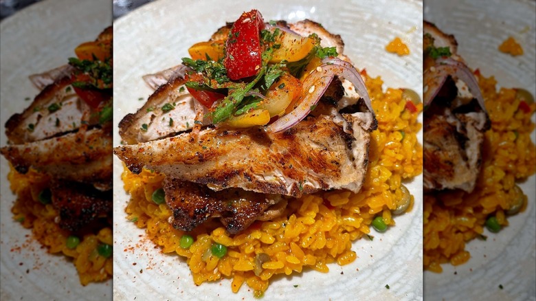 Colorful pan-fried fish on rice from Cafe La Trova.