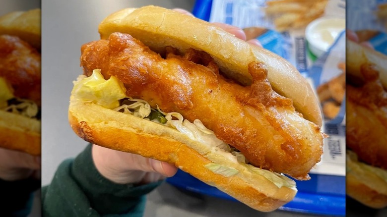 A Culver's fish sandwich in hand