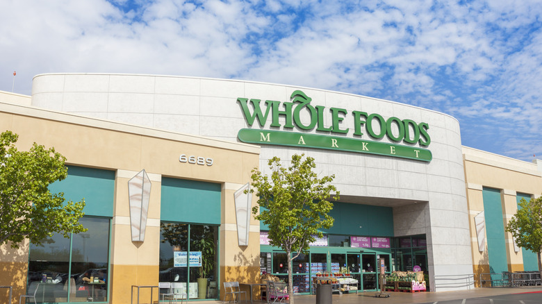 whole foods storefront on a bright sunny day