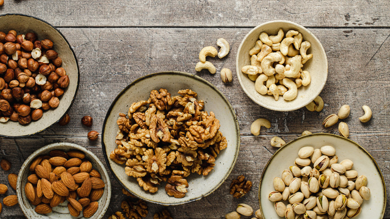 Overhead image of bowls of assorted nuts