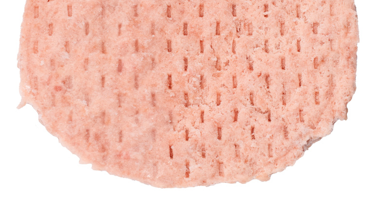 Closeup of a frozen turkey burger patty