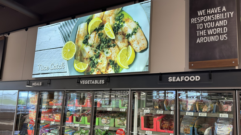 Freezers at Aldi holding vegetables and seafood