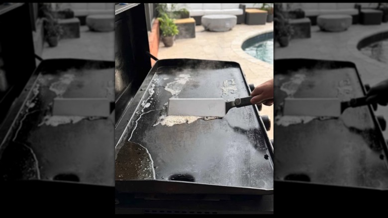 Blackstone griddle being cleaned