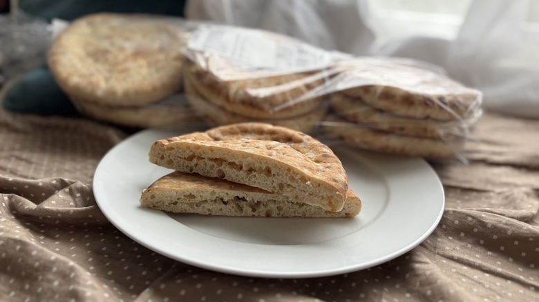 Costco pita bread sliced and on a white plate