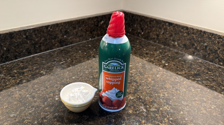 Garelick Farms canned whipped cream beside filled white dish on countertop