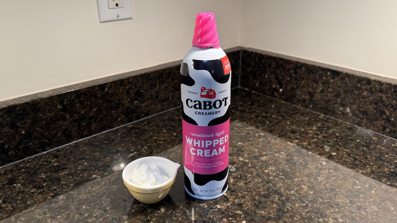Cabot Creamery canned whipped cream beside filled white dish on countertop