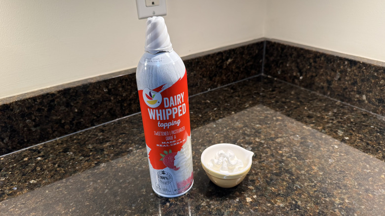 Stop & Shop canned whipped cream beside filled white dish on countertop