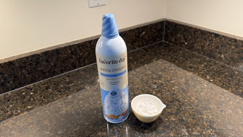 Favorite Day canned whipped cream beside filled white dish on countertop