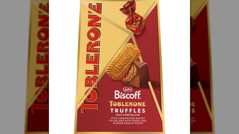 A box of Biscoff Toblerone Truffles Milk Chocolate with the big Toblerone logo and an image of a Biscoff cookie, and individually wrapped chocolate.
