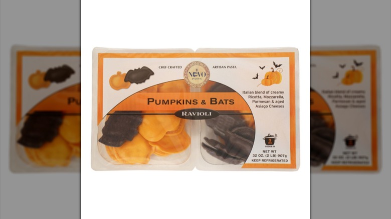 A package of Nuovo Pasta Pumpkin & Bats Ravioli with pumpkin- and bat-shaped pasta visible through clear packaging.