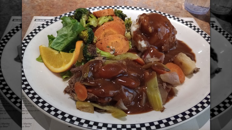 A plate of pot roast with vegetables at Black Bear Diner