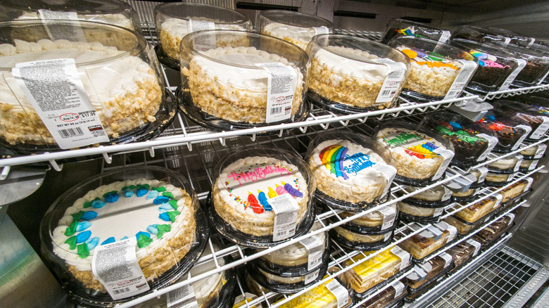 A cooler full of a variety of Costco cakes