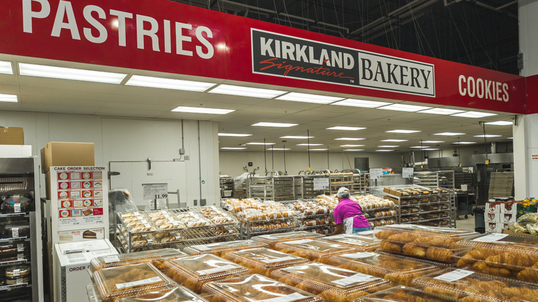 Tables and shelves of fresh-baked bread and pastries at the Costco bakery