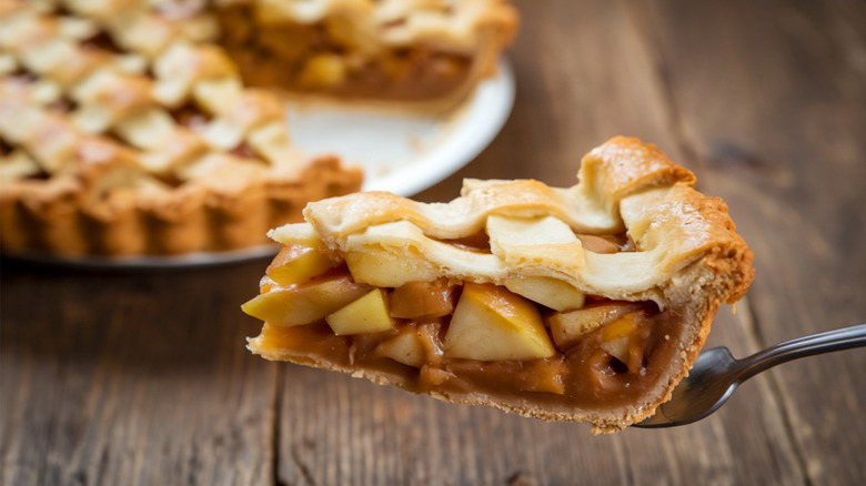 A large slice of lattice-topped apple pie