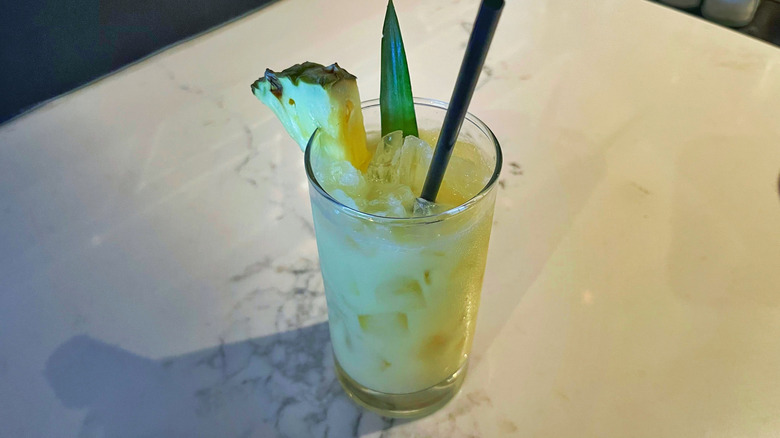 The Coconut Crush cocktail from Bonefish Grill on a marble background