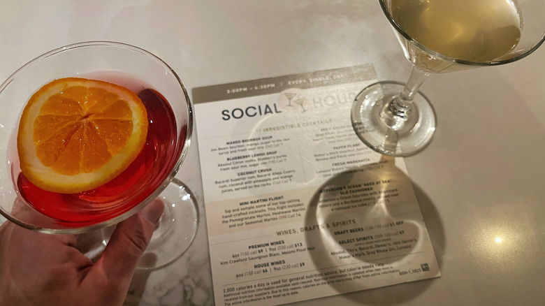 Two cocktails on top of a Social Hour menu at Bonefish Grill