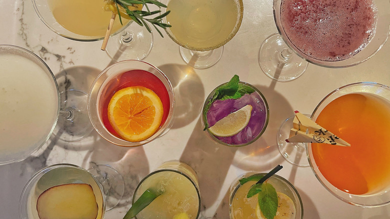 A variety of cocktails from Bonefish Grill on a marble counter