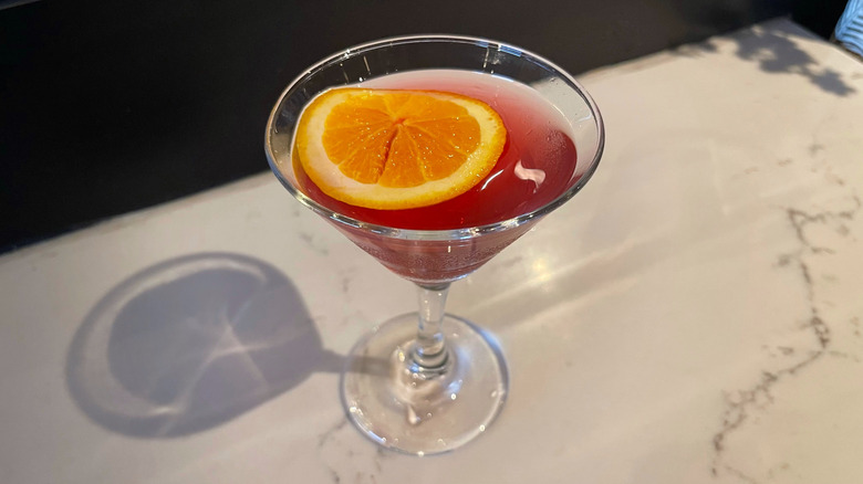 The Pomegranate Martini from Bonefish Grill on a marble background