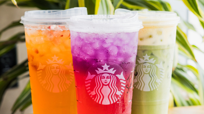 Three colorful Starbucks iced drinks