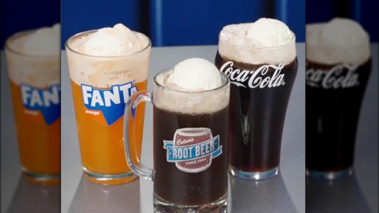 Fanta orange float, root beer float and Coca-Cola float from Culvers on table
