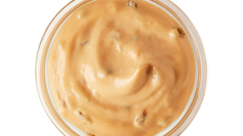 A glass container with Big Mac Sauce in it