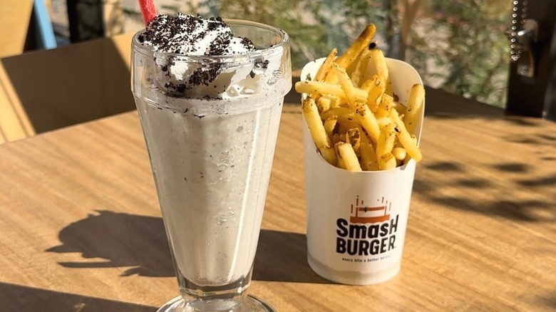 An OREO Cookies & Cream Shake and a side of fries from Smashburger