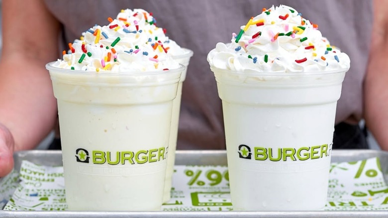 A tray of vanilla milkshakes with rainbow sprinkles from BurgerFi