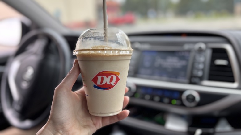 hand holding cup of Dairy Queen coffee