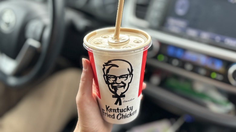 hand holding KFC cup
