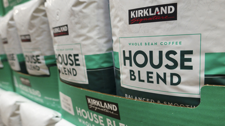 Bags of Kirkland Signature House Blend Whole Bean Coffee stocked at Costco