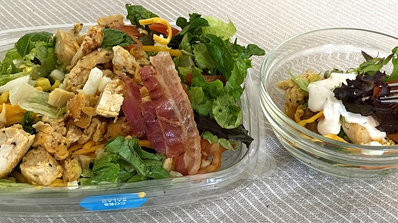 Wedny's Cobb salad with a sample on a table