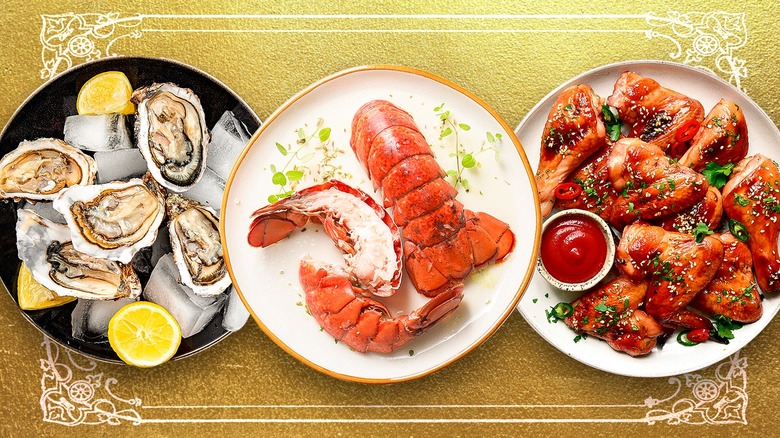 photo showing three plates, one with oysters, ice cubes, and lemon quarters; one with lobster tails; and one with chicken wings and a container of sauce