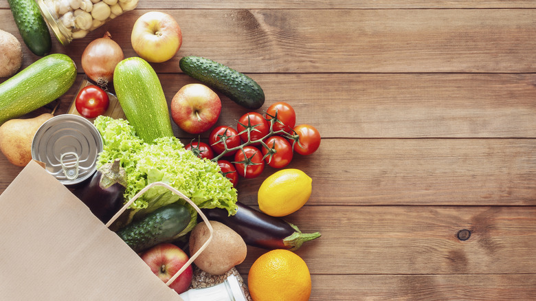 Food shopping on wooden kitchen top counter