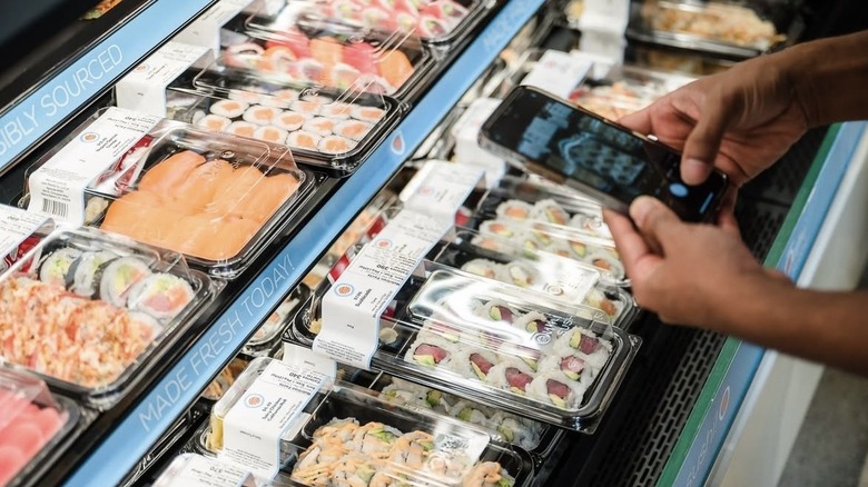 taking photo of sushi